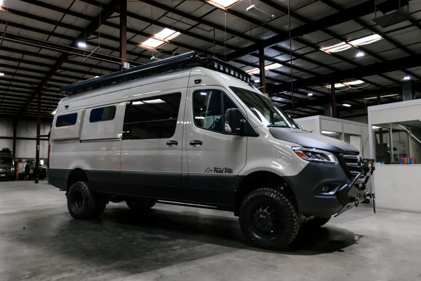 Field Vans Canyon camper van parked outdoors with side doors open