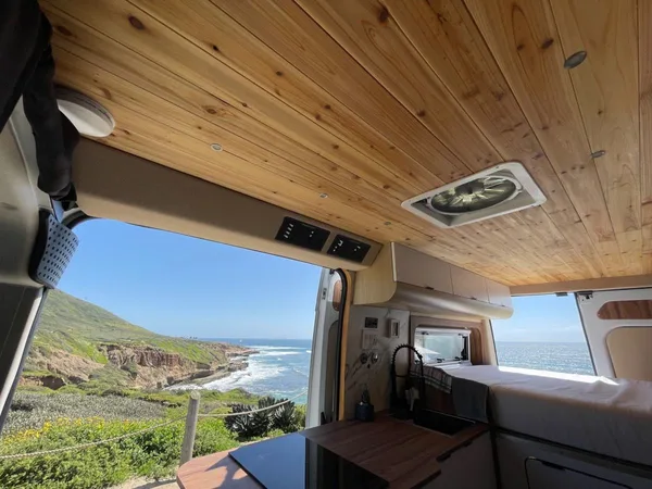 Noovo B-Adventure camper van parked at an outdoor campsite