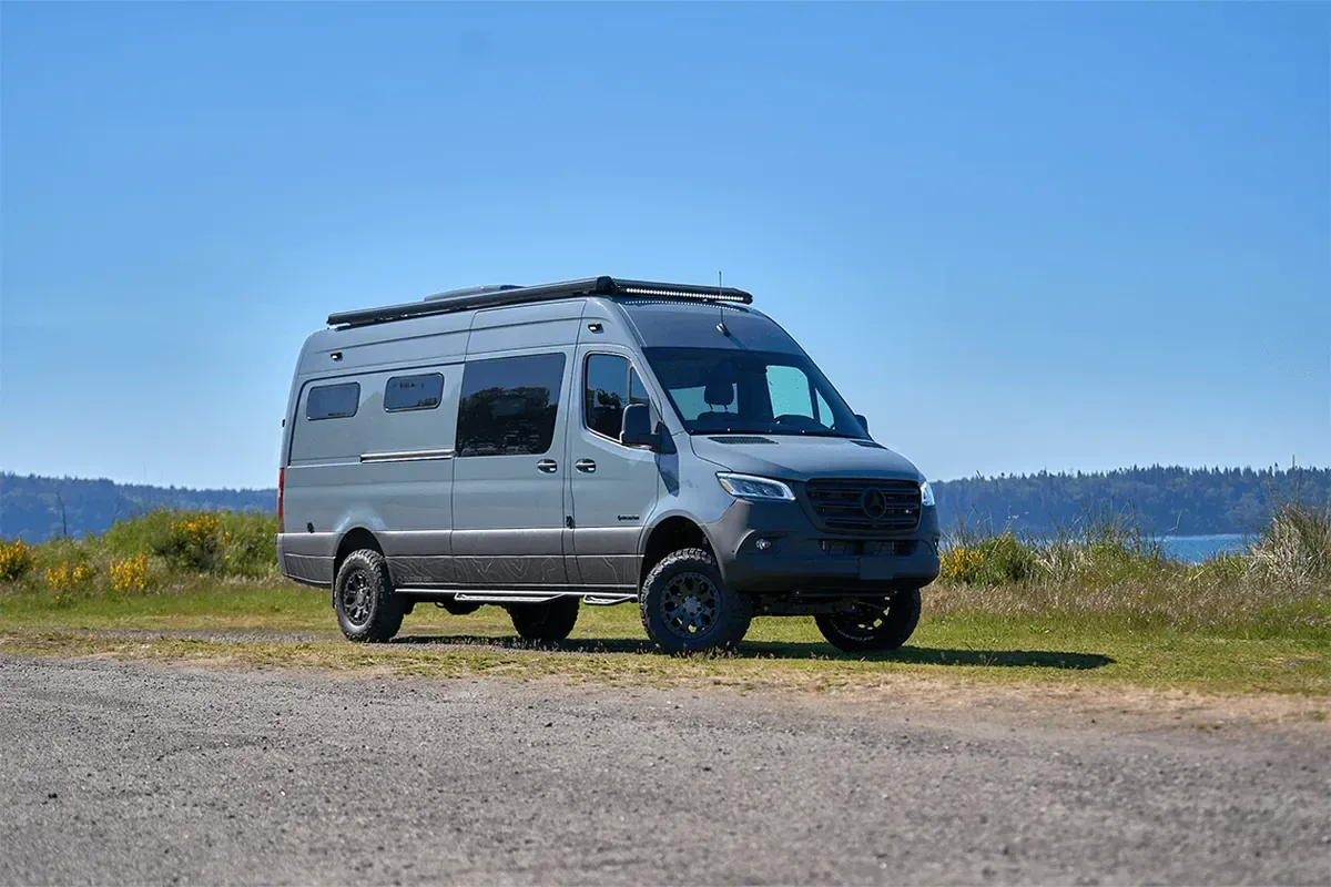 Outside Van 31 Flavors camper van parked outdoors showing high roof and AWD Sprinter chassis