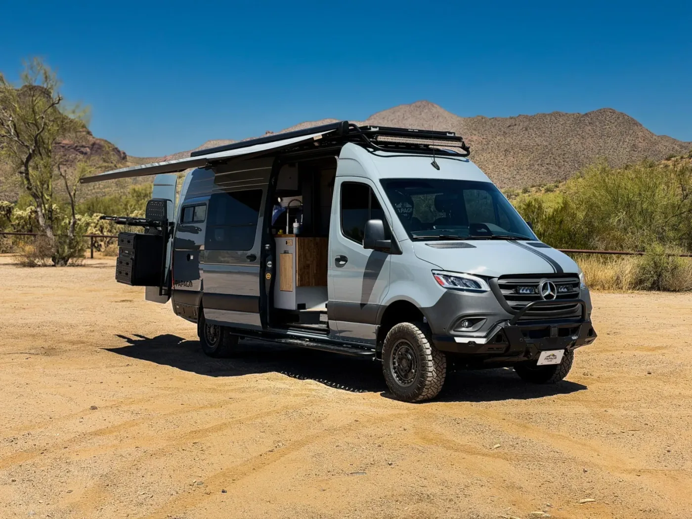 Papago Vans El Capitan luxury camper van parked in a scenic outdoor setting