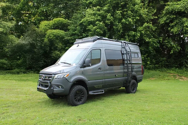 Remote Vans Aegis AWD adventure camper van parked in rugged outdoor terrain