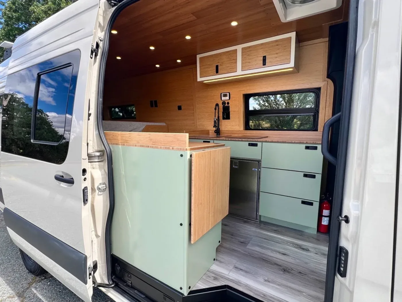 Scenic Vans The Shasta custom camper van parked in a natural outdoor setting