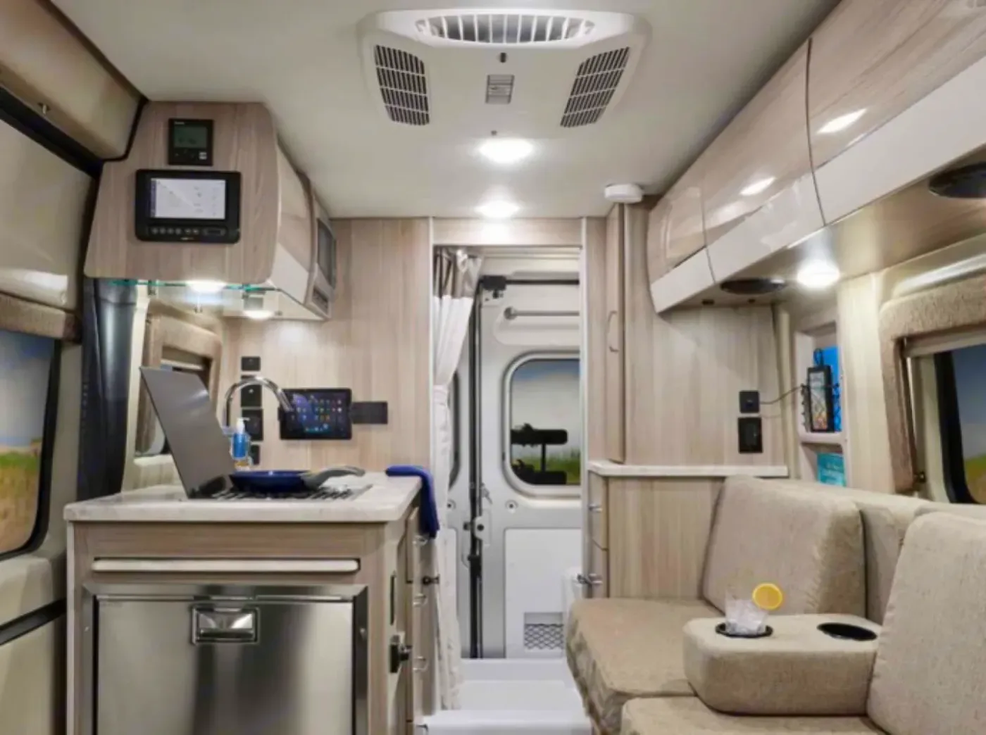 Thor Motor Coach Scope camper van parked at a scenic outdoor campsite