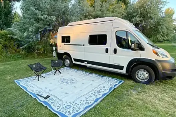 Winnebago Solis camper van parked at an outdoor campsite